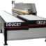 Doucet return conveyor
